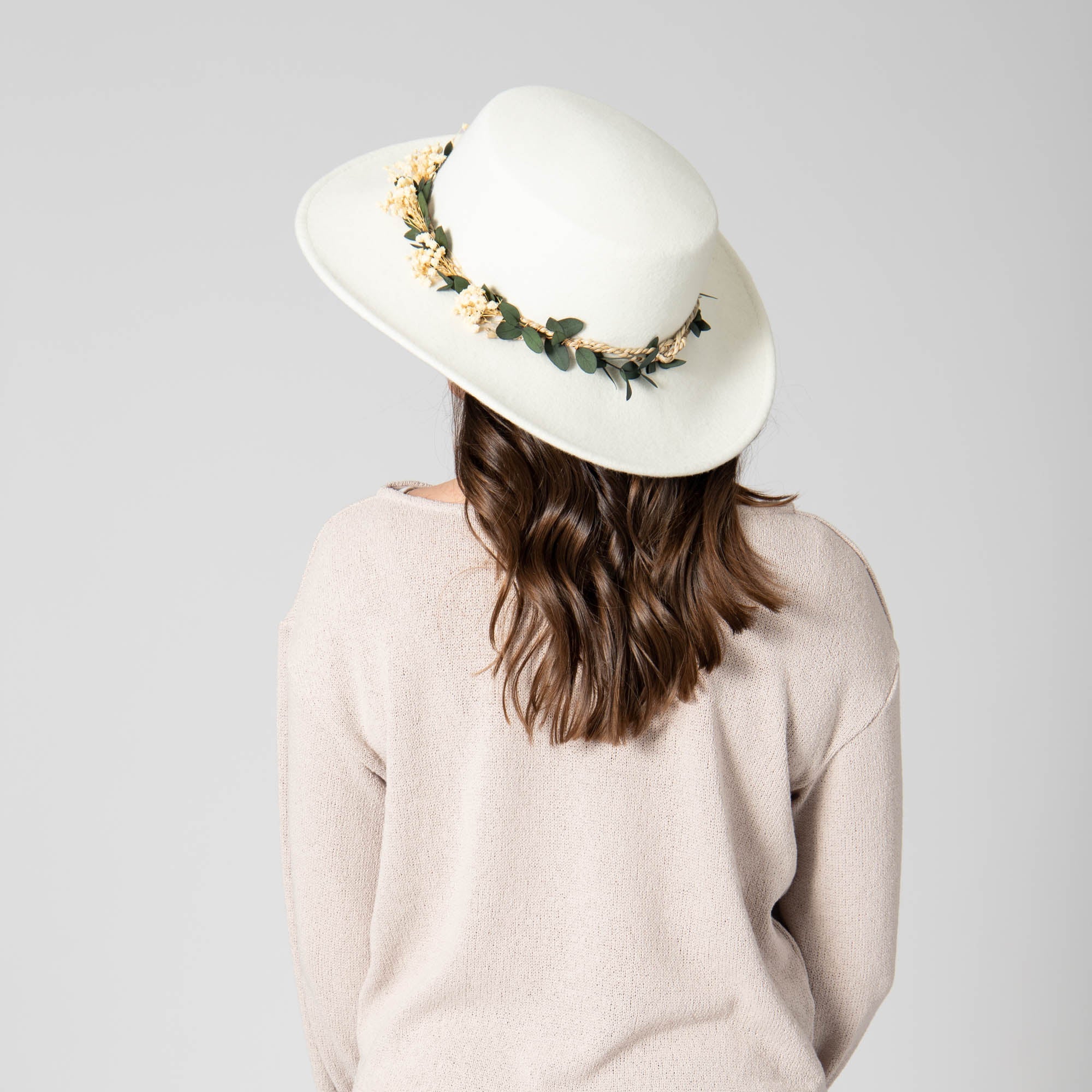 Floral-adorned wide hat